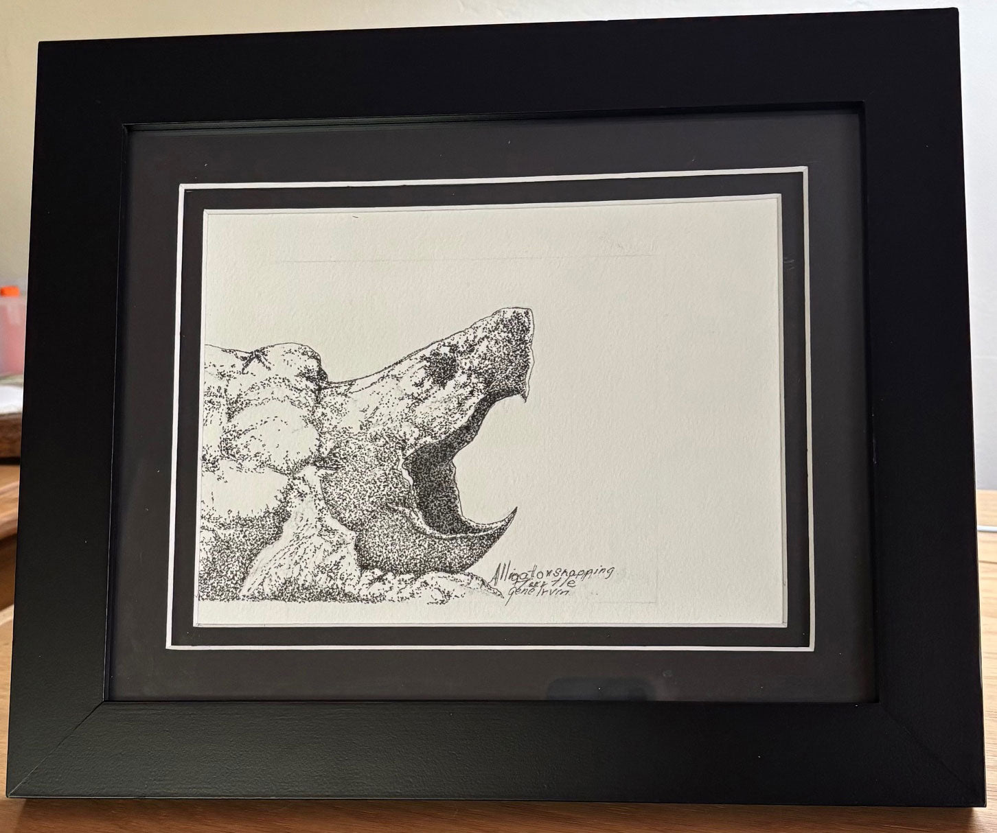 Original framed pen and ink artwork of an alligator snapping turtle by Gene Irvin, featuring intricate stippling, rugged reptilian texture, and wildlife-inspired black and white detailing.