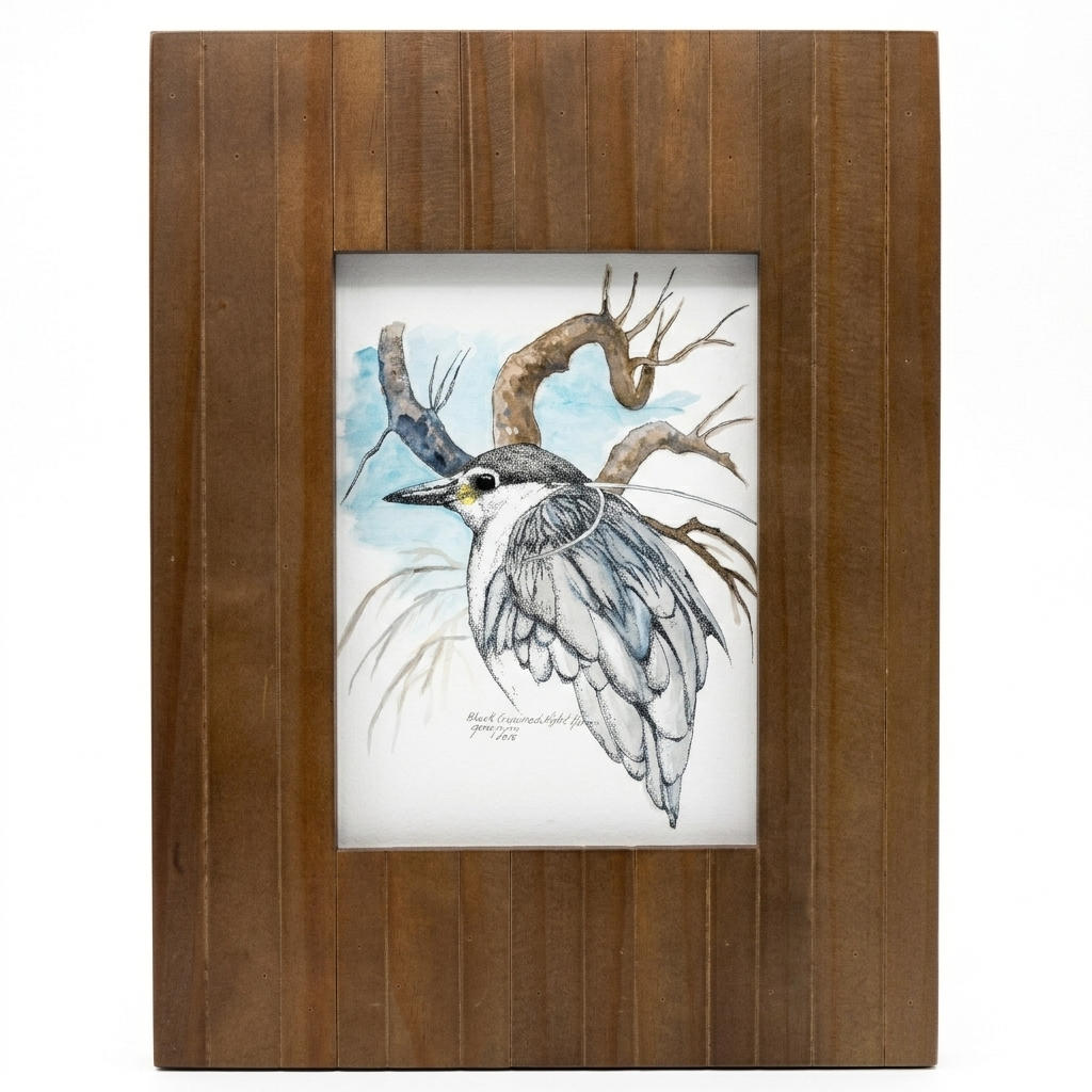 Black-crowned Night Heron framed Giclée print by Gene Irvin, 2015 — ink stippling and watercolor portrait of a Black-crowned Night Heron hunched on a gnarled twisting branch with long white plume feathers trailing, black cap, yellow lore, dark eye, and grey-blue wing plumage against a soft blue watercolor sky, warm brown wood plank frame, 5x7 inch print, 8.5x12 inches overall, ready to hang