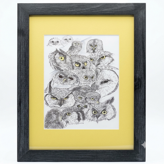 Hidden Owls Eyes framed art print by Gene Irvin — pen and ink collage of multiple owl faces with yellow eyes, matted and displayed in a dark wood frame, 12x15 inches