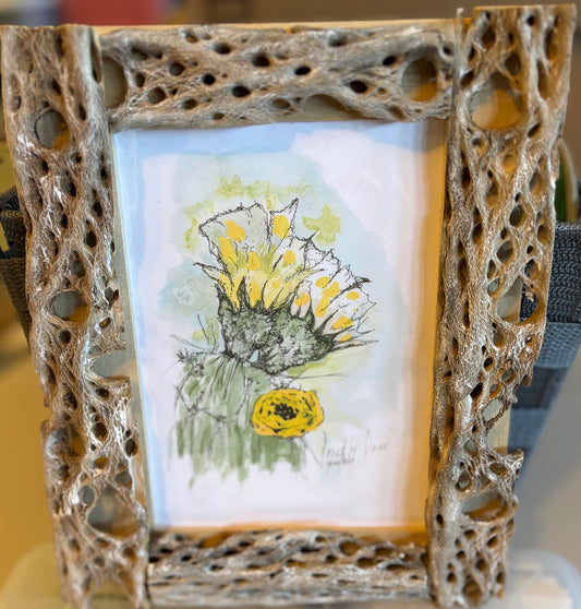 Yellow Prickly Pear Cactus Flower fine art print by Gene Irvin — loose ink and watercolor illustration of yellow prickly pear blooms, displayed in a handcrafted Cholla cactus skeleton frame by Bill Radtke, 5x7 print, 7.25x9.25 inches overall